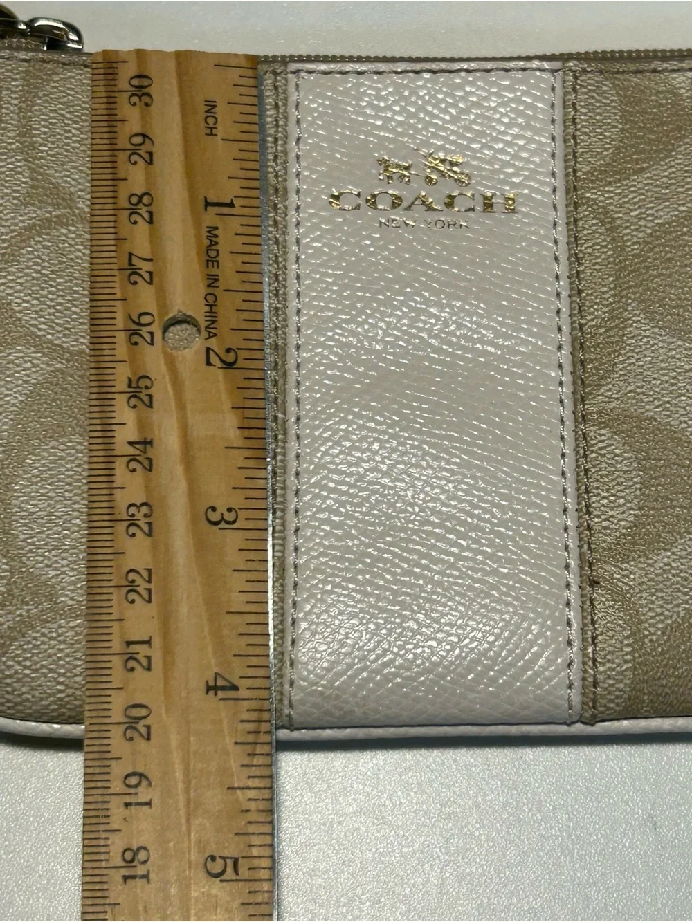 Coach Signature Canvas Zip Wristlet in Neutral Khaki Cream includes hang tag